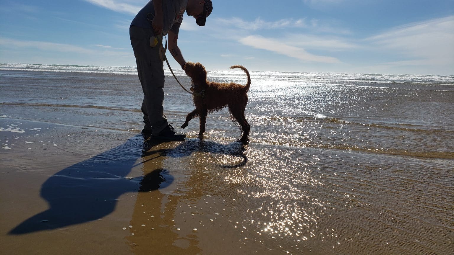 Aldo with his dog on the beach